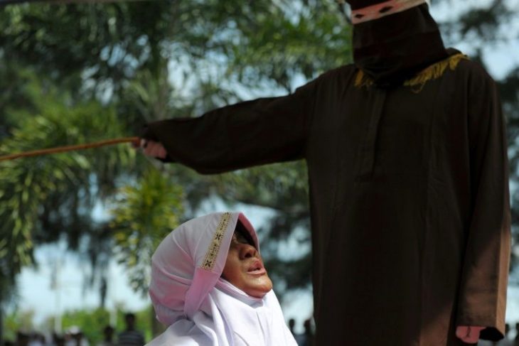Indonesian Sharia police thrash teenagers with canes in public for having sex