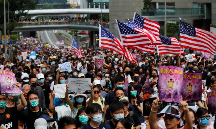 Hong Kong protesters praise Trump, Congress for law; Beijing calls move sinister